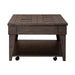 Arrowcreek Lift Top Cocktail Table in Weathered Stone - Discount Furniture World (Burlington,NC)